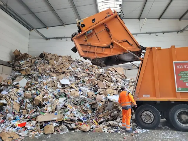 Garbage truck representing waste from printing