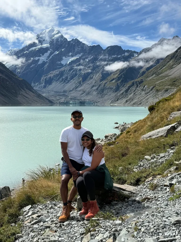Founders of InvoGuide, Yasa and Pula, posing in front of Aoraki, Mt Cook in New Zealand.